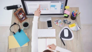 Entrepreneur using AI tools to create workshop outlines, lesson scripts, and teaching materials for an online training program.